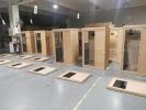 Hemlock Mini one person far infrared door on the left of the indoor sauna room